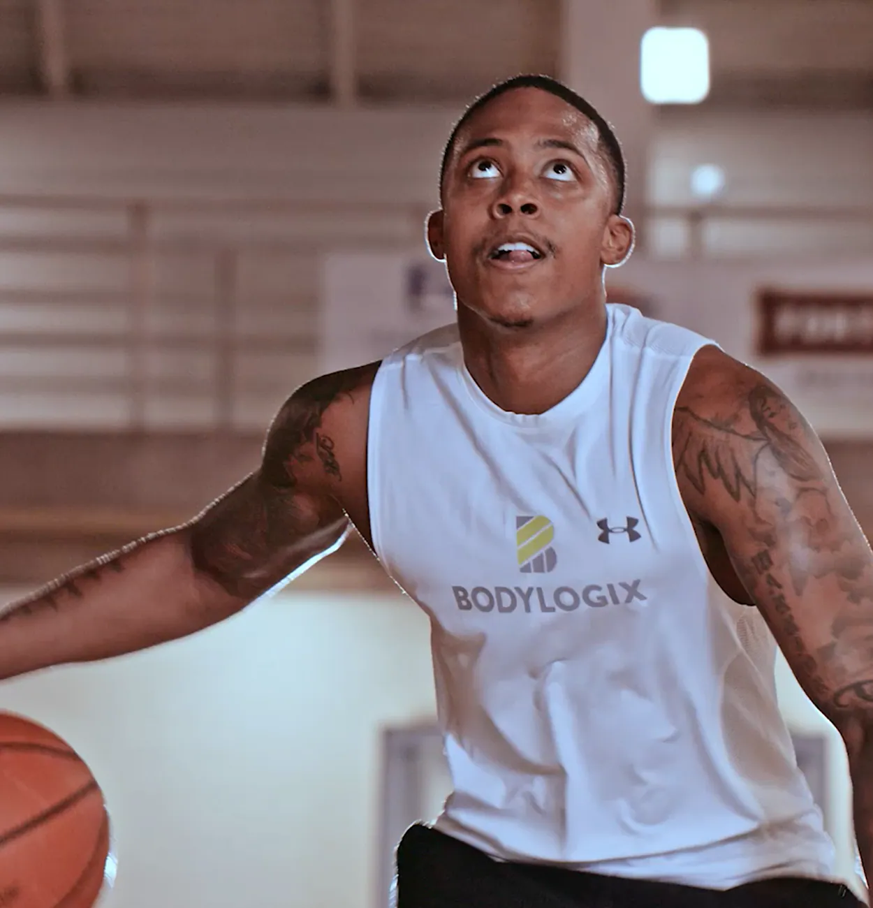 An image of a man dribbling a basketball.